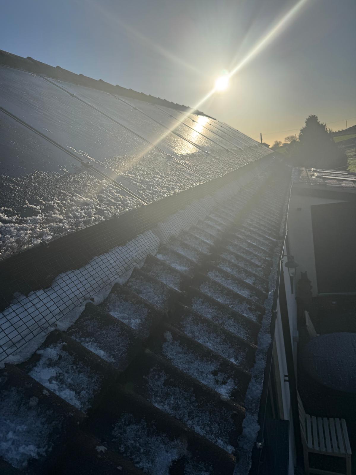 solar panels on a roof in winter.